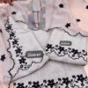 Cream muslin embroidered Punjabi suit with black floral embroidery and dupatta